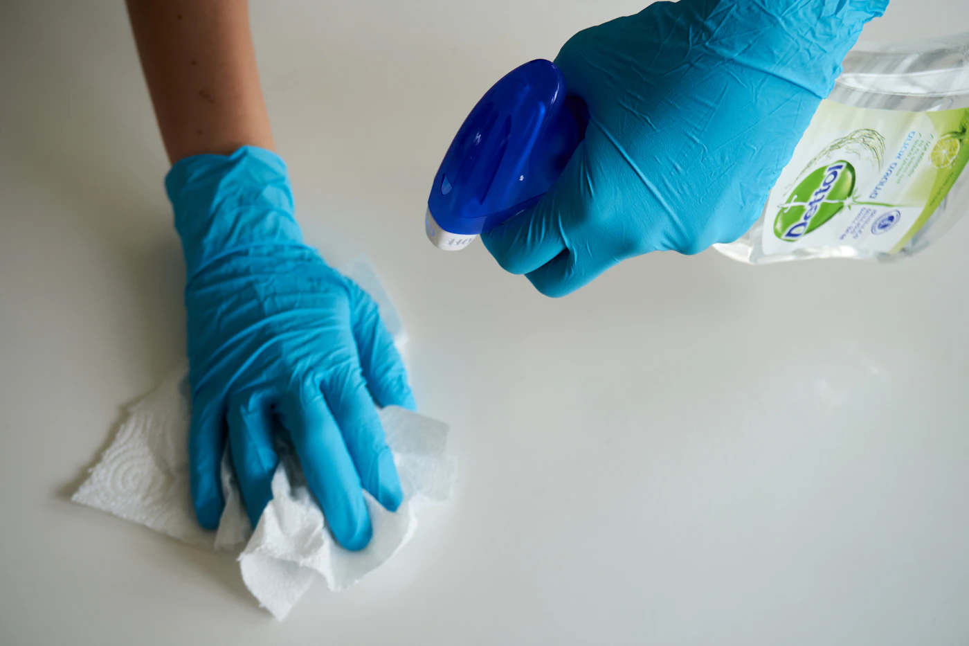 Cleaning professional wiping down a surface